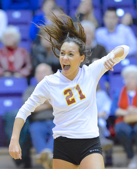 Jeff Lange | The Vindicator  Mooney's Marcella Adams celebrates a point during game three of the Cardinals' match with Gilmour Academy, Thursday night in Barberton.