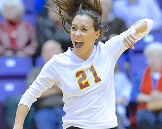 Jeff Lange | The Vindicator  Mooney's Marcella Adams celebrates a point during game three of the Cardinals' match with Gilmour Academy, Thursday night in Barberton.