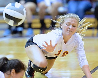 Jeff Lange | The Vindicator  Cardinal Mooney senior Brooke Fonderlin (16) dives for a low ball during Thursday night's game with Gilmour Academy in Barberton. Mooney was trampled by the Lancers in 3 games.