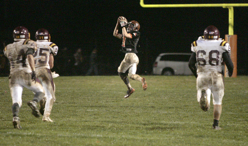  .          ROBERT  K. YOSAY | THE VINDICATOR..Third quarter action as Springfields #1 Ian Grdina was wide open down the center and took the pass to the one yard line before being tripped up -#68 SR Derek Fickes  #14 Neil Buzzacco  #25 Nick Stanton look on....South Range took an early lead and never looked back as week 10 is in the books....-30-