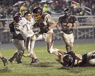  .          ROBERT  K. YOSAY | THE VINDICATOR..South Range #19 Ryan Miller breaks a tackle by  Springfields  #54 Tim Vinkler as he gains 6 yards - blocking for him is sr #77  #59  Springfield  Brian Swansiger  is behind him..Evan SchaeferSouth Range took an early lead and never looked back as week 10 is in the books....-30-