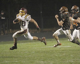  .          ROBERT  K. YOSAY | THE VINDICATOR..#30 SR  Joe Alessi takes the ball around the end and in for a score  as #22 Springfield Nate Simboli and #54 Tim Vinkler give chase..asSouth Range took an early lead and never looked back as week 10 is in the books....-30-