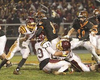 .          ROBERT  K. YOSAY | THE VINDICATOR..Springfield #10  Graham Mincher is met at the line by SR #14 Neil Buzzacco #19 yan Miller and #21 JR Renforth - Springfields #11 Ryan Kohler looks on..South Range took an early lead and never looked back as week 10 is in the books....-30-