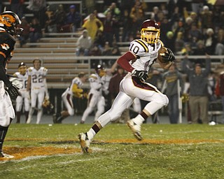  .          ROBERT  K. YOSAY | THE VINDICATOR..#10 SR Greg Dunham takes off on his run for a TD a in the first quarter as Springfireld  24 Cory Stouffer can only watch..South Range took an early lead and never looked back as week 10 is in the books....-30-