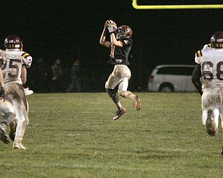  .          ROBERT  K. YOSAY | THE VINDICATOR..Third quarter action as Springfields #1 Ian Grdina was wide open down the center and took the pass to the one yard line before being tripped up -#68 SR Derek Fickes  #14 Neil Buzzacco  #25 Nick Stanton look on....South Range took an early lead and never looked back as week 10 is in the books....-30-