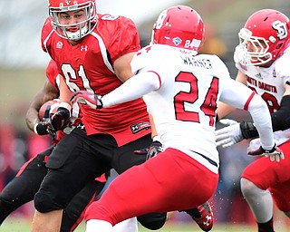YOUNGSTOWN, OHIO - NOVEMBER 1, 2014:Justin Spencer #61 of YSU sprints to block Jacob Warner #24 of South Dakota during the 1st half of Saturday afternoon NCAA football game at Stambaugh Stadium. YSU won 28-17. (Photo by David Dermer/Youngstown Vindicator)