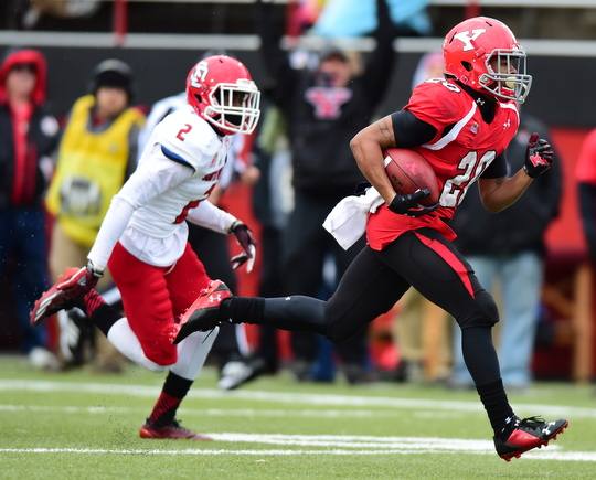 YOUNGSTOWN, OHIO - NOVEMBER 1, 2014: Jody Webb #20 of YSU sprints into the end zone to score a touchdown after getting past Micheal Lilly #2 of South Dakota during the 1st half of Saturday afternoon NCAA football game at Stambaugh Stadium. YSU won 28-17. (Photo by David Dermer/Youngstown Vindicator)