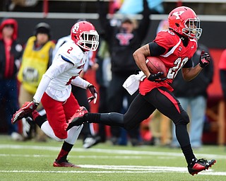 YOUNGSTOWN, OHIO - NOVEMBER 1, 2014: Jody Webb #20 of YSU sprints into the end zone to score a touchdown after getting past Micheal Lilly #2 of South Dakota during the 1st half of Saturday afternoon NCAA football game at Stambaugh Stadium. YSU won 28-17. (Photo by David Dermer/Youngstown Vindicator)