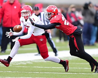 YOUNGSTOWN, OHIO - NOVEMBER 1, 2014:Nate Dortch #27 of YSU breaks on the football to slap it out of the hands of Auston Johnson #1 of South Dakota during the 1st half of Saturday afternoon NCAA football game at Stambaugh Stadium. YSU won 28-17. (Photo by David Dermer/Youngstown Vindicator)