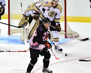 YOUNGSTOWN, OHIO - NOVEMBER 1, 2014: Kiefer Sherwood #44 of the Phantoms plays the bouncing puck in front of David Trinkberger #5 and Eric Schierhorn #29 of Muskegon during the 1st period of Saturday nights game. (Photo by David Dermer/Youngstown Vindicator)