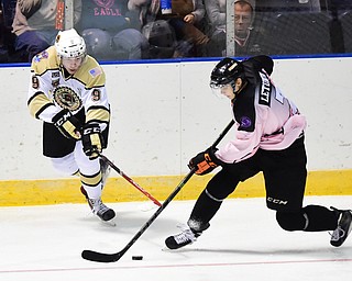 YOUNGSTOWN, OHIO - NOVEMBER 1, 2014: Max Letunov #7 of the Phantoms takes the puck away from Bo Hanson #9 of Muskegon during the 1st period of Saturday nights game. (Photo by David Dermer/Youngstown Vindicator)