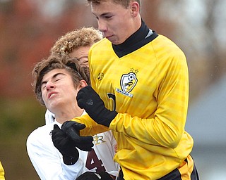 Jeff Lange | The Vindicator  South Range's Mark Vennetti (4) collides with Beachwood's Vonya Shiffman as they both attempt to head the ball in the first half of their Regional Final, Saturday at Ravenna High School.