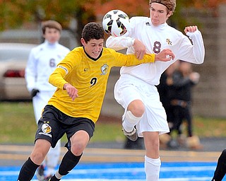 Jeff Lange | The Vindicator  Beachwood's Bogatur Askaryan (left) and Cole Durina (right) of South Range run into each other as they both make a play for the ball during second half action at Gilcrest Field in Ravenna during the Regional Finals, Saturday afternoon.