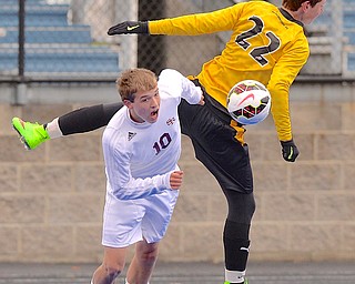 Jeff Lange | The Vindicator  South Range's Brandon Youngs (10) runs past Beachwood's Cameron Krantz (22) after heading the ball toward the net in second half action in Ravenna, Saturday afternoon during the Regional Finals.