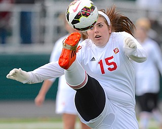 Jeff Lange | The Vindicator  Cardinal Mooney's Emilee Mulhall eyes the ball as she kicks it over her head in the second half of Mooney's matchup with Elyria, Saturday in Nordonia.