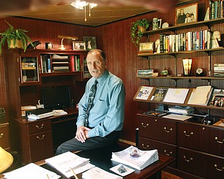        ROBERT K. YOSAY  | THE VINDICATOR..Nick Moga is celebrating his firmÕs 25th anniversary. A photo of him working at his firm will suffice. The firm is at his home that has a separate entrance for his clients. ....-30-