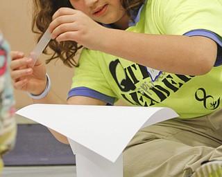        ROBERT K. YOSAY  | THE VINDICATOR..some paper and some tape and   DiAsia Mercado (ok)  builds the base of her paper tower..Elementary students from throughout the Youngstown school district gather for the first time to talk about  the Quaqlia program.  Quaglia program is aimed at bolstering academic achievement .....-30-