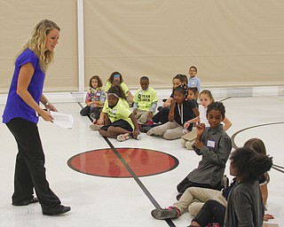        ROBERT K. YOSAY  | THE VINDICATOR..setting up groups from the Quaglia Institute is Julie Hellerstein....Elementary students from throughout the Youngstown school district gather for the first time to talk about  the Quaqlia program.  Quaglia program is aimed at bolstering academic achievement .....-30-