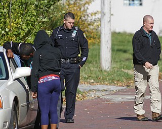        ROBERT K. YOSAY  | THE VINDICATOR..on Covington YPD investigates a  blot of blood as a person was taken away before police arrived..E...-30-