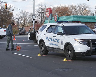        ROBERT K. YOSAY  | THE VINDICATOR..YPD crime lab investigates a crash of an YPD car and private car.. two people including the officer was reported to be taken to the hospital with minor injuries.. the accident happened at Market and Midlothian...-30-