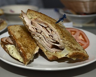 Katie Rickman | The Vindicator.The "Down the Stretch Turkey" sandwich at Saadeys Place in Austintown that features smoked turkey with monterey jack cheese, tomato, lettuce and chive mayo on multi grain bread and runs for $8 was one of the many featured items that Brothers in Food tried out on Thursday, Oct. 30, 2014.