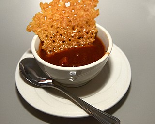 Katie Rickman | The Vindicator.The Tomato Bisque at Saadeys Place in Austintown also comes with an asiago cheese crisp on Thursday, Oct. 30, 2014.