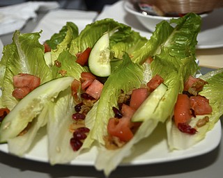 Katie Rickman | The Vindicator.Hearts Are Wild is one of the salad options at Saadeys Place in Austintown and is topped with dried cranberries, candied walnuts, asiago crisps, tamatoes and cucumbers. The dish runs at $8 a plate.