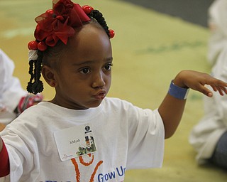  .          ROBERT  K. YOSAY | THE VINDICATOR..Jemyah Parker listens as  the story is read ....At the Mill Creek Childrens Center Preschoolers participated in the Guinness World Record attempt at largest vocabular lesson. ItÕs sponsored by PNC Bank...-30-