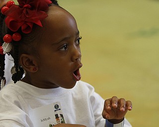  .          ROBERT  K. YOSAY | THE VINDICATOR..Jemyah Parker listens as  the story is read ....At the Mill Creek Childrens Center Preschoolers participated in the Guinness World Record attempt at largest vocabular lesson. ItÕs sponsored by PNC Bank...-30-