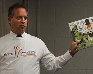  .          ROBERT  K. YOSAY | THE VINDICATOR..Ted Schmidt  President of PNC bank Youngstown tells a bit about the story the students will read..At the Mill Creek Childrens Center Preschoolers participated in the Guinness World Record attempt at largest vocabular lesson. ItÕs sponsored by PNC Bank...-30-