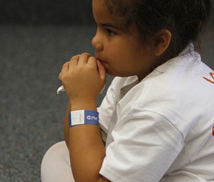  .          ROBERT  K. YOSAY | THE VINDICATOR..Payton Gordan  4 with the authenticating wrist band listens as the vocabulary words are explained..At the Mill Creek Childrens Center Preschoolers participated in the Guinness World Record attempt at largest vocabular lesson. ItÕs sponsored by PNC Bank...-30-