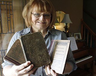  .          ROBERT  K. YOSAY | THE VINDICATOR..Shirley Eckley, the McGuffy descendant, holds a few of the readers she still has in her possesion she is related to william holmes mcguffey - joann jones reporter.-30-
