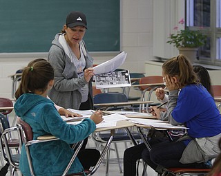  .          ROBERT  K. YOSAY | THE VINDICATOR..Checking on a group of students - volunteer Melissa Wern asks about the problem..Polands McKinleyÕs math club meets. before school and is  thriving math enrichment programs, with the help of volunteers and staff....-30-