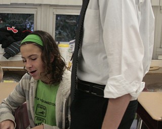  .          ROBERT  K. YOSAY | THE VINDICATOR..Jackie Grisdale a 6th grade shows the solution to Teacher Bruce Daley ( 5th grade math)..Polands McKinleyÕs math club meets. before school and is  thriving math enrichment programs, with the help of volunteers and staff....-30-