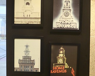 Katie Rickman | The Vindicator.Old photographs on display at The Home Savings and Loan Company shows the building in its transitional phases throughout the years on Friday, October 31, 2014. The bank is has been in business for 125 years.