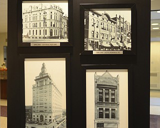 Katie Rickman | The Vindicator.Old photographs on display at The Home Savings and Loan Company shows the building in its transitional phases throughout the years on Friday, October 31, 2014. The bank is has been in business for 125 years.