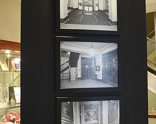 Katie Rickman | The Vindicator.Old photographs on display at The Home Savings and Loan Company shows the building in its transitional phases throughout the years on Friday, October 31, 2014. The bank is has been in business for 125 years.