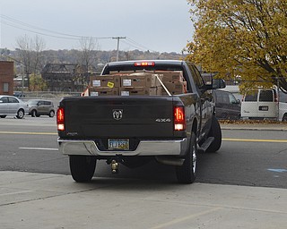 Katie Rickman | The Vindicator.The Lewis family of Boardman back their truck full of frozen turkey into the front parking lot of the Rescue Mission of the Mahoning Valley in Youngstown on Friday, Oct. 31, 2014.  Jon and Jennifer Lewis delivered 1,300 pounds of turkey to the mission, all the turkey was donated by a group of 25 people and a donation from the Boardman Rotary.