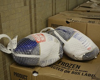 Katie Rickman | The Vindicator.Frozen turkey sits on top of a box of more turkey at the Rescue Mission of the Mahoning Valley on Friday, Oct. 31, 2014.  Jon and Jennifer Lewis delivered 1,300 pounds of turkey to the mission, all the turkey was donated by a group of 25 people and a donation from the Boardman Rotary.