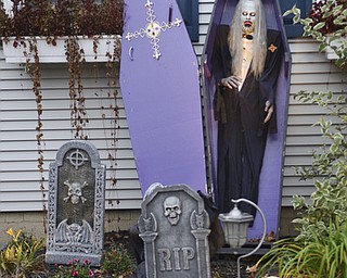 Katie Rickman | The Vindicator.The front yard of Karen and Scott Price at 512 Moore Street in Hubbard was decorated with tomb stones and a vampire, the front yard was a gruesome site for trick-or-treaters on Thursday, Oct. 30, 2014.