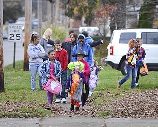 Katie Rickman | The Vindicator.Children trick-or-treat in Hubbard from 5-7 on Thursday, Oct. 30, 2014.