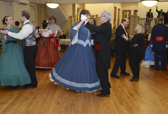 Katie Rickman | The Vindicator.Priscilla Diem of Bay Village, Ohio and Jerry Gerber of Chardon dance a waltz at The Governor David Tod Civil War Ball at the Tyler History Center in Youngstown on Saturday, Nov. 1, 2014.