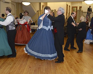 Katie Rickman | The Vindicator.Priscilla Diem of Bay Village, Ohio and Jerry Gerber of Chardon dance a waltz at The Governor David Tod Civil War Ball at the Tyler History Center in Youngstown on Saturday, Nov. 1, 2014.