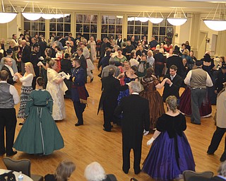 Katie Rickman | The Vindicator.The ballroom floor filled with dancers dressed in Civil War period dress for The Governor David Tod Civil War Ball at the Tyler History Center in Youngstown on Saturday, Nov. 1, 2014.