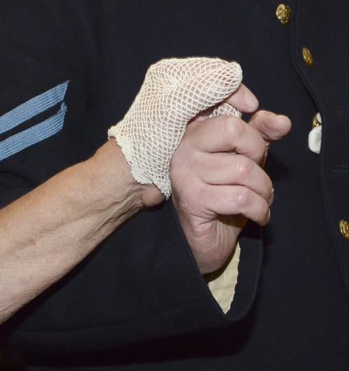 Katie Rickman | The Vindicator.A couple dressed in Civil War period clothing clasp hands during a waltz at The Governor David Tod Civil War Ball at the Tyler History Center in Youngstown on Saturday, Nov. 1, 2014.