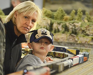 Katie Rickman | The Vindicator.Mason Schlegelmilch, 3 of Ravenna and his great aunt Lori Marchand of Austintown watch as a train passes him during an openhouse at the Youngstown Model Railroad Association in Austintown on Sunday Nov.2, 2014. Schlegelmilch and his family are among the approx. 2,500 who will visited the facility over its 6 day event according to Dean Demain, Vice President of the society.  The association will have two more open house events November 8-9 and December 6-7 from 12pm-6pm each day.  The cost of admission is $4 for adults, children 11 and under are free.