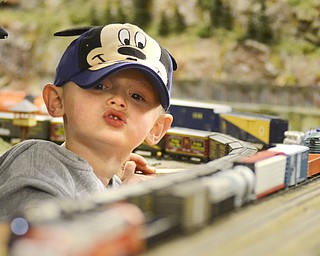 Katie Rickman | The Vindicator.Mason Schlegelmilch, 3 of Ravenna watches as a train passes him during an openhouse at the Youngstown Model Railroad Association in Austintown on Sunday Nov.2, 2014. Schlegelmilch and his family are among the approx. 2,500 who will visited the facility over its 6 day event according to Dean Demain, Vice President of the society.  The association will have two more open house events November 8-9 and December 6-7 from 12pm-6pm each day.  The cost of admission is $4 for adults, children 11 and under are free.