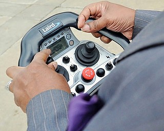 Jeff Lange | The Vindicator  A view of one of Laird's LRC-M Radio Control Systems being used to drive a skid steer around the parking lot of Laird's facility in Warren, Thursday afternoon.