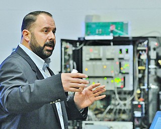 Jeff Lange | The Vindicator  Laird's Scott Lordo speaks about remote controlled cranes and how they are used, Thursday morning during a demonstration at the Laird building.