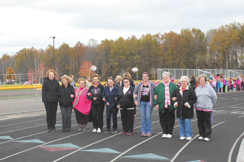 SPECIAL TO THE VINDICATOR
On Oct. 22, the staff and students at Joseph Badger Elementary School participated in a Pink Ribbon event for breast cancer awareness, organized by Caryn Ewell and Holly Blackburn. Staff, students and parents walked on the track for a half-hour with breast cancer survivors and a parent who is undergoing chemotherapy. Money raised during the mini-relay for life was presented at the Pink Ribbon Cheer Classic at YSU on Oct. 26. From left to right are Linda Falatic, Bette Kistler, Lori Roknick, Crystal Hudspeth, Luinda Johnson, Carlene Lindus, Amy Timko, Darlene Peterson, Bonnie Skibo and Jackie Siekkinen.